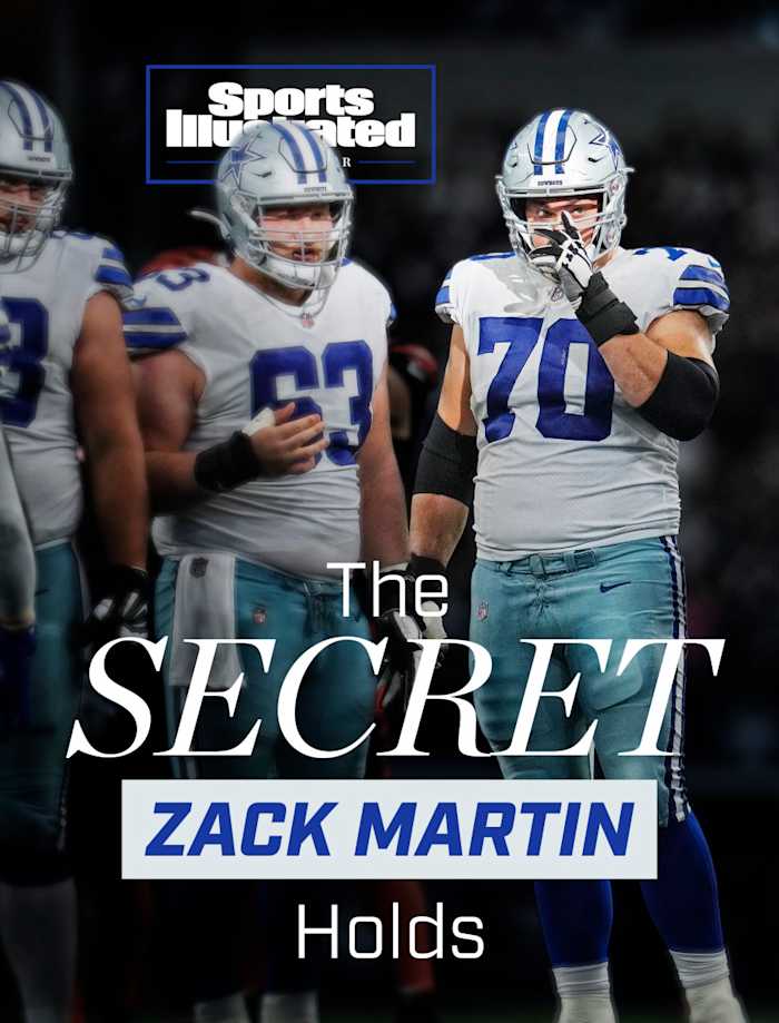 Zack Martin stands before a Cowboys huddle